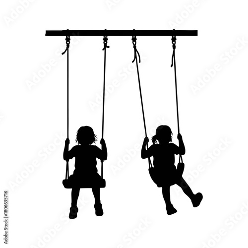 Silhouette of a child playing on a swing