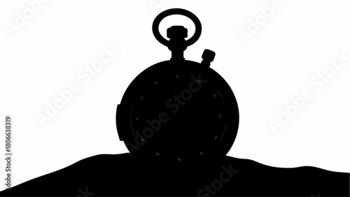 Silhouette of a vintage pocket watch resting on a dark surface against a bright white background view