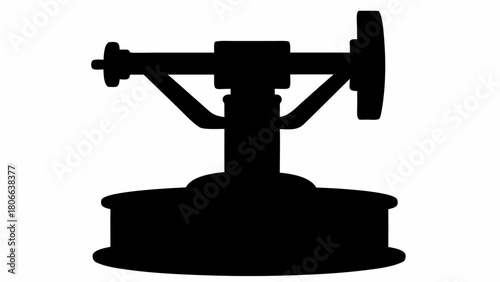 Silhouette of a complex mechanical apparatus with wheel and supports on a circular base structure