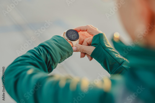 Close-up of woman in sportswear checking smartwatch 