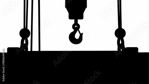 Silhouette of a crane with a hook suspending a heavy object in a stark black and white illustration