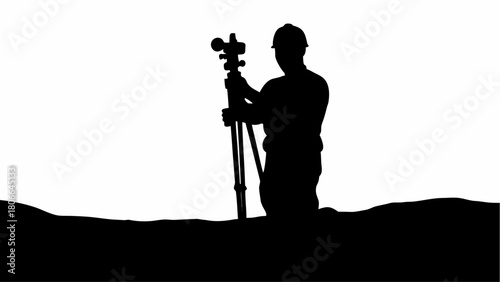 Silhouette of surveyor with hard hat using surveying equipment on uneven ground outdoors in black and white