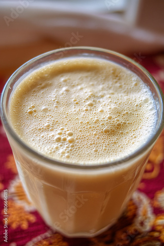 A close-up of Mahewu (fermented maize drink), thick and creamy, a refreshing, traditional non-alcoholic beverage.
