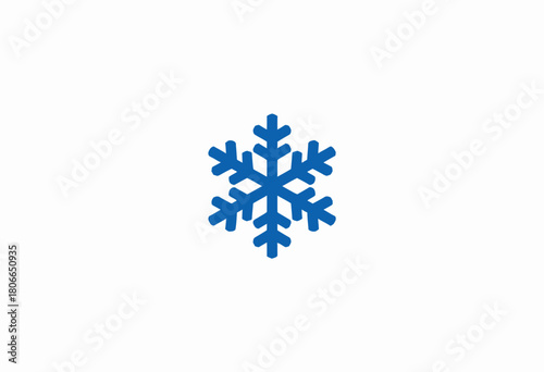 A single detailed blue snowflake icon displaying symmetrical patterns on a crisp white background symbolizing winter and the beauty of nature in simplicity