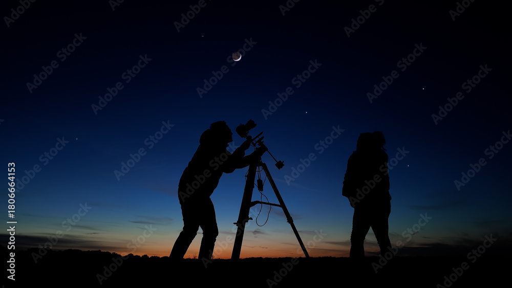 Fototapeta premium Amateur astro-photographers with a camera on a tripod photographing night sky with stars, planets, Moon and other celestial objects.