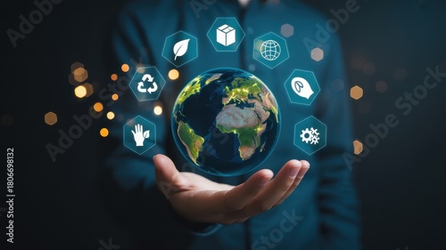 Person presenting holographic digital icons representing global environmental responsibility above an illuminated terrestrial sphere