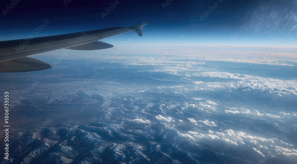 Naklejka premium High-altitude view of Earth's landscape from an airplane