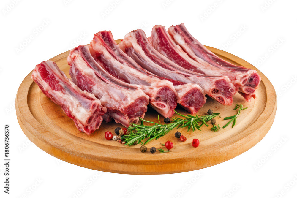 Fototapeta premium Fresh raw lamb ribs arranged on a wooden cutting board garnished with aromatic herbs and colorful peppercorns. ready for cooking or grilling. highlighting culinary preparation in a clean kitchen envir