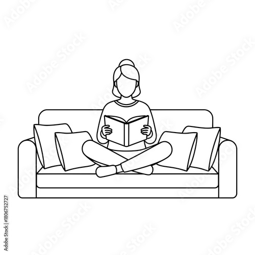 Woman reading a book on the sofa isolated on relaxing at home with a novel, enjoying leisure time in a cozy and comfortable setting