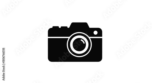 Close-up of a vintage camera lens reflecting a bright, abstract light.