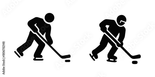 Two ice hockey players in action poses, one with a helmet, both handling a puck with their sticks.