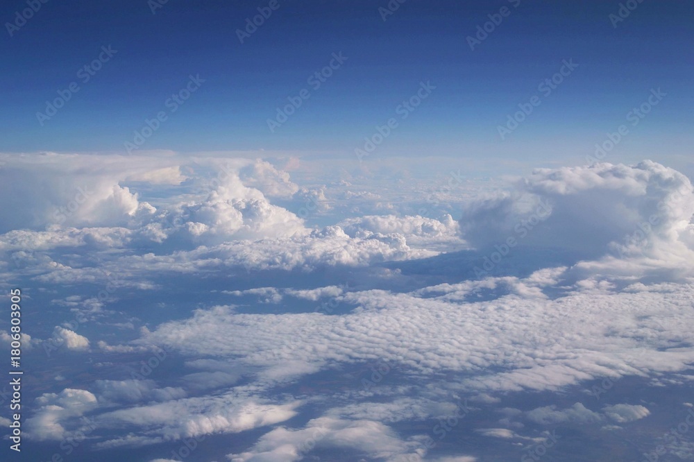 Fototapeta premium Cloud layers above green rural landscape