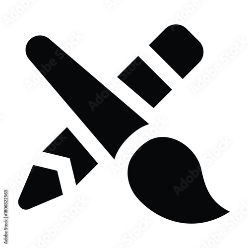 Solid black glyph of a pencil and brush crossed, representing creativity, drawing, painting, design, and artistic activities.