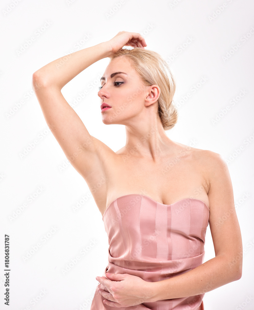 Fototapeta premium Beautiful young woman holding her arms up and showing clean underarms. Armpit's care. Armpit epilation, hair removal, perfect skin.