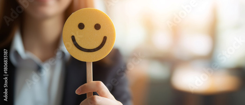 Businesswoman Holding Smile Emoji Sign. Workplace Happiness, Positive Customer Feedback, Employee Satisfaction, Office Cheer, Happy Mood. Panoramic bg