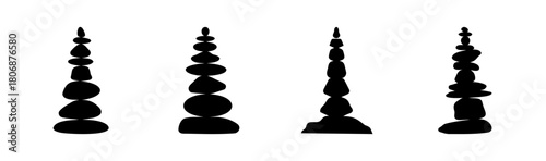 Four balanced stone stacks silhouettes representing zen harmony