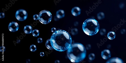 Wallpaper Mural Shimmering blue soap bubbles floating on a dark background,  light,  macro Torontodigital.ca