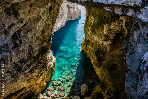 Gaeta, Latina, Lazio, Italy. A splendid view of the city. The ancient village with its houses overlooking the sea. The spectacular Grotta del Turco on the Montagna Spaccata (Split Mountain) cliff.