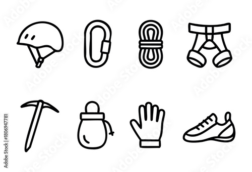A collection of climbing gear is displayed, featuring a helmet, carabiner, ropes, harness, ice pick, chalk bag, gloves, and climbing shoes, highlighting safety equipment for outdoor climbing activitie