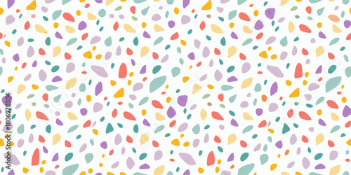Colorful abstract terrazzo pattern with irregular shapes on white background