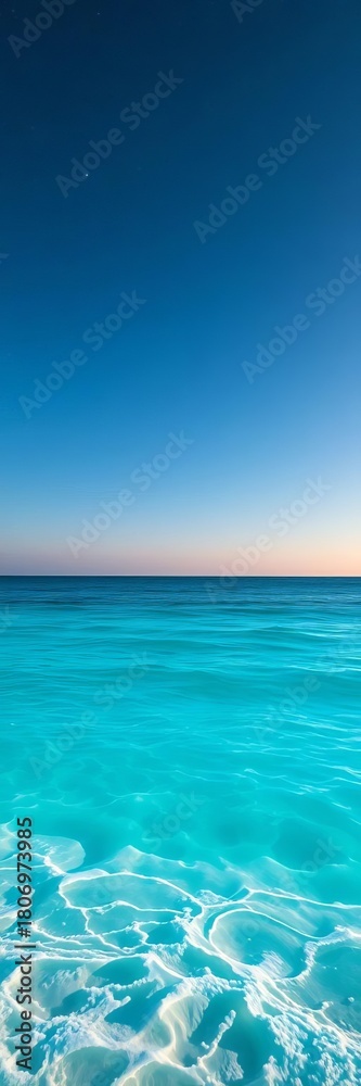 Obraz premium Serene beach scene with azure ocean meeting vast summer sky and distant stars, offering a peaceful escape, thinking, waves