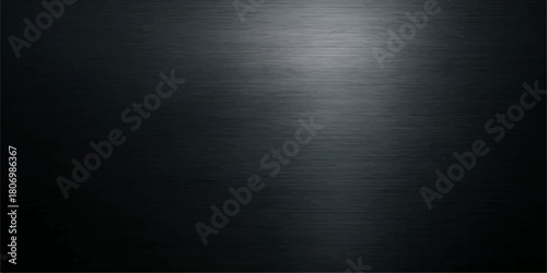Dark brushed metal texture with a spotlight on a gray metallic surface