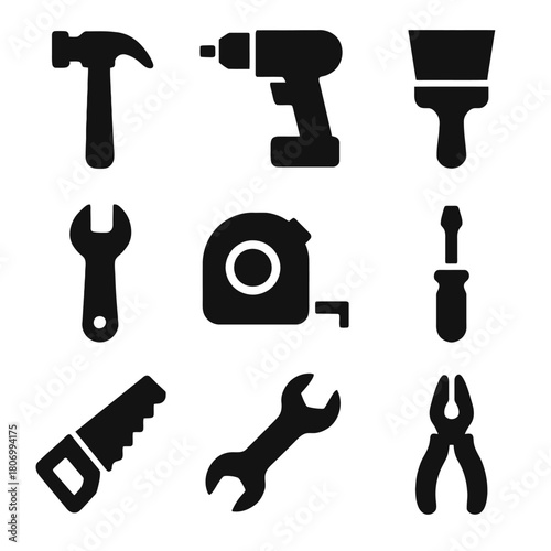 Black silhouettes of hand tools: hammer, drill, wrench, and more