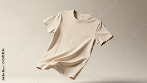Blank Beige T-shirt Mockup Floating in Air on a Neutral Studio Background