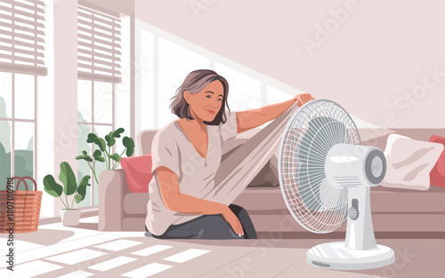 Woman using a fan to cool down on a hot day