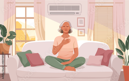 Elderly woman meditating peacefully on a couch at home, serene and mindful
