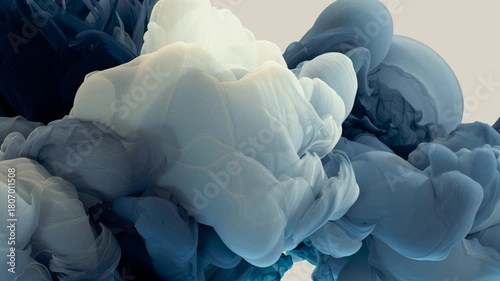 Abstract cloud-like forms in blue and white tones blending in soft gradients.