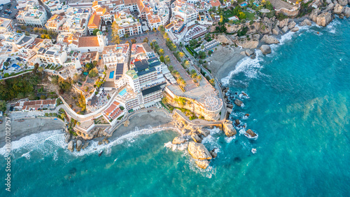 Aerial photo from drone to Balcony of Europe in Nerja resort town on Costa del Sol Mediterranean sea coast at sunsetin Andalusia, Spain. 