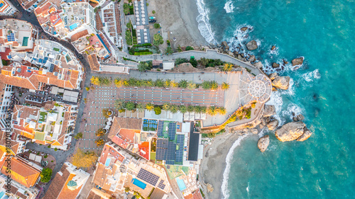 Aerial photo from drone to Balcony of Europe in Nerja resort town on Costa del Sol Mediterranean sea coast at sunsetin Andalusia, Spain. 