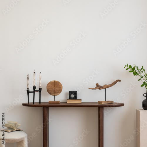 Stylish and minimalist composition on wooden design commode with copy space, flowers in vase, decorations and personal accessories. Template.