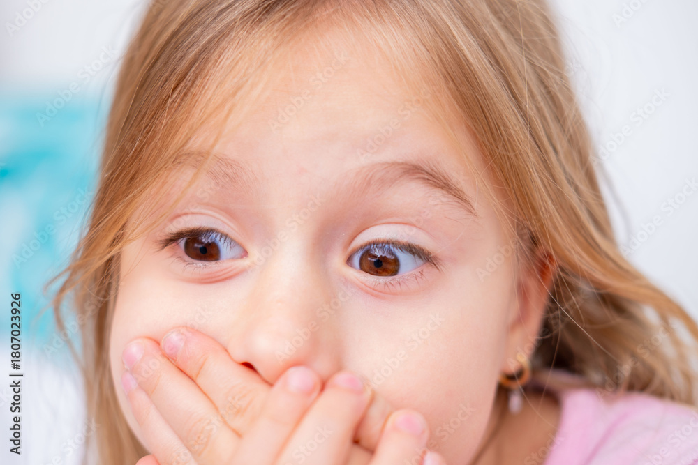 Obraz premium child covering mouth with hands, expressing fear speaking, shyness, social anxiety, struggle begin articulation, expressing silence, suppress cough or sneeze, Childhood shyness and secret keeping