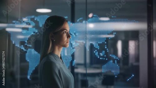 Woman looking at holographic world map with glowing data connections and facial recognition grid face