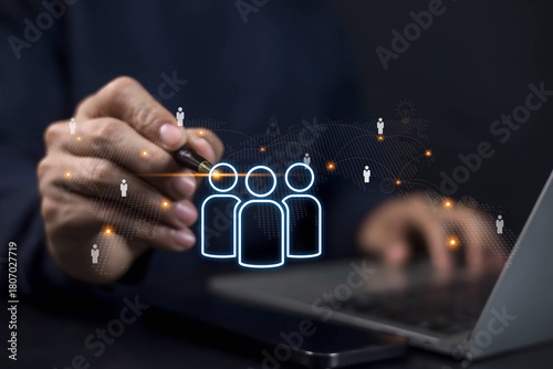 Businessman using digital technology for human resource management, recruitment, and team connection. Concept of networking, employee data, and HR innovation in modern business.
