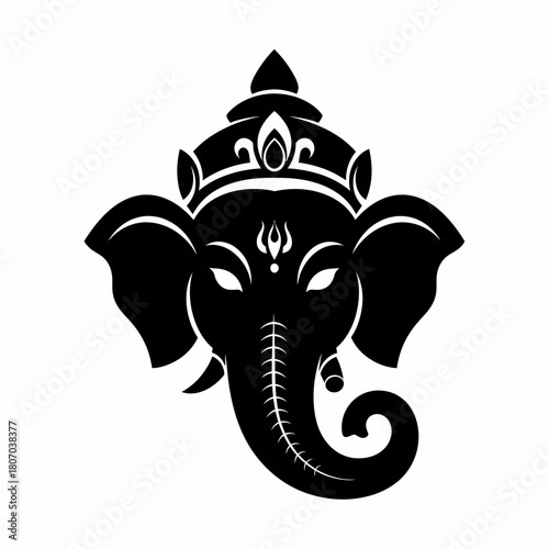 A stylized black silhouette of the Hindu deity Ganesha's head, adorned with a crown on a plain white background.