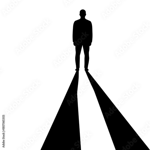 Silhouette of a Man Standing with Long Shadows.
