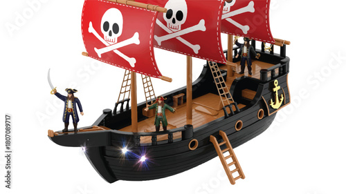 A detailed toy pirate ship model with red sails featuring white skull and crossbones symbols 