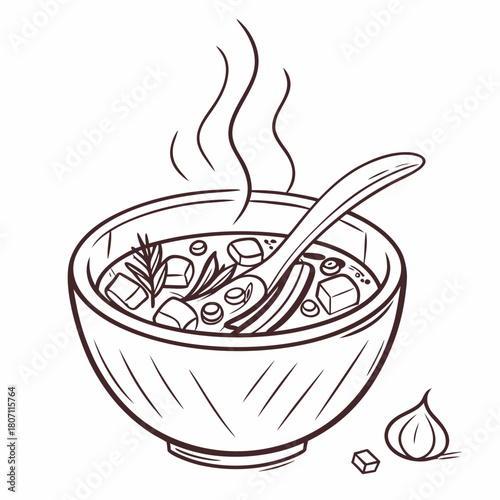 Steaming bowl of hearty soup with spoon and garlic