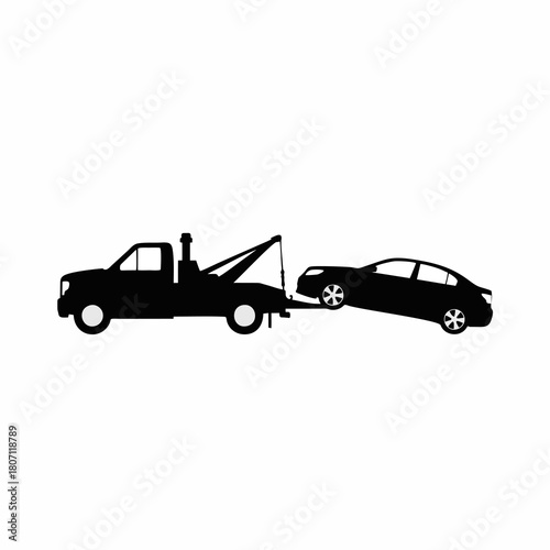 silhouette vector of a tow truck transporting a broken down car