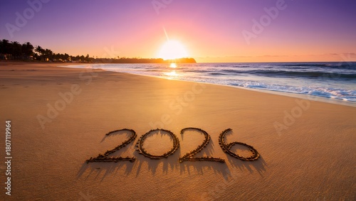Fototapeta Naklejka Na Ścianę i Meble -  The year 2026 written in the sand on a beach at sunset