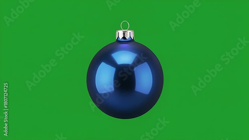 Shiny blue christmas bauble ornament isolated on a green screen background