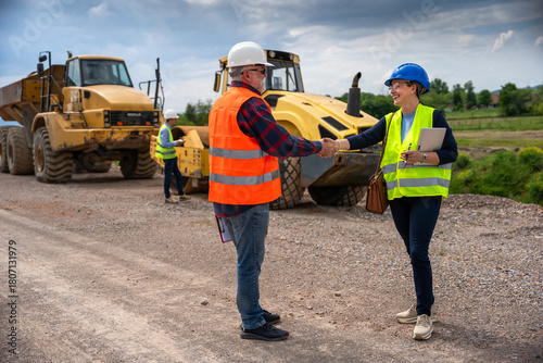 Highway engineers discuss and plan.