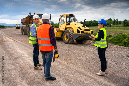 Highway engineers discuss and plan.