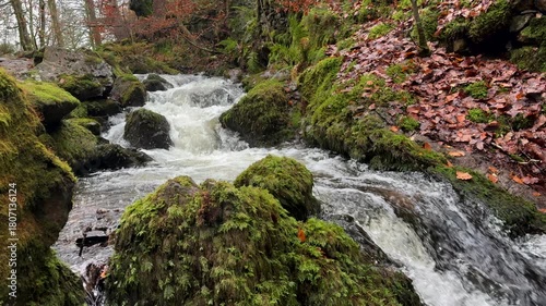 River in the Lake District close up slow motion in nature wild and rugged landscape. England walking and hiking area UK 4K