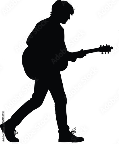 Silhouette of a person playing an acoustic guitar.