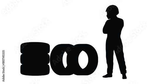 Silhouette of racer with tires ready for race day event prep