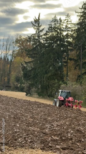 tractor plowing field in autumn